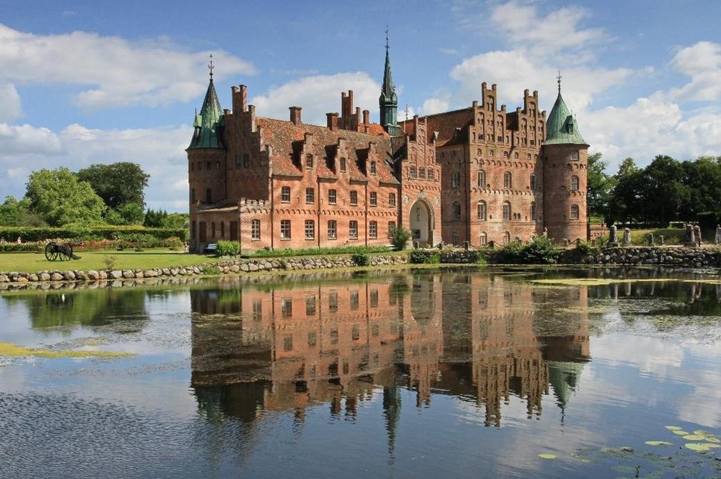 Egeskov Castle in front of a lake