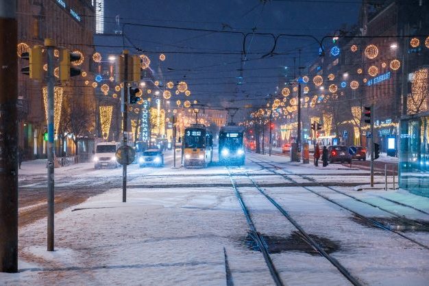 Night time in Helsinki with pram running in the snow