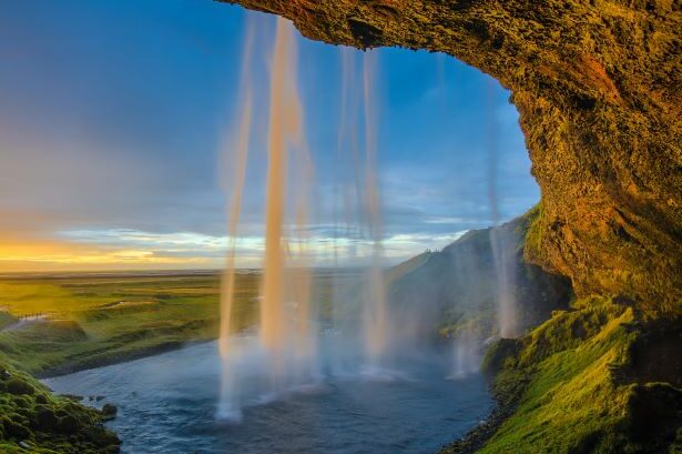 Waterfall in iceland seen from within the waterfall