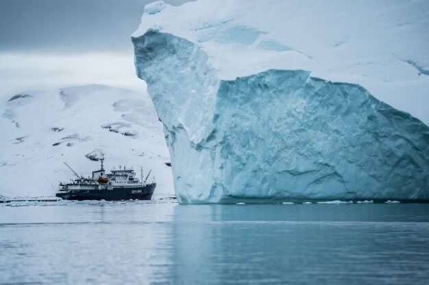 Ship next to iceberg